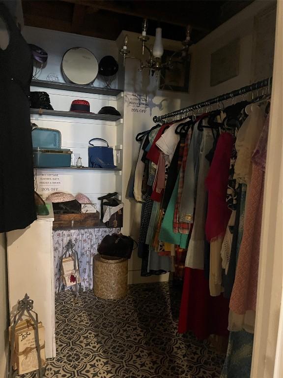 walk in closet featuring tile patterned flooring