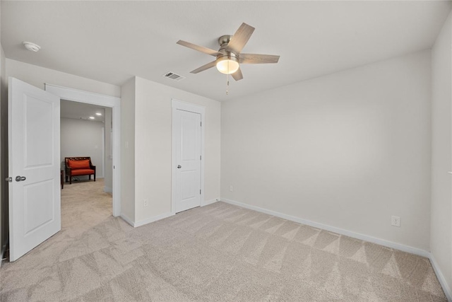 1512 Honaker Way, Leander, TX 78641 - unfurnished bedroom with light carpet, baseboards, and a ceiling fan