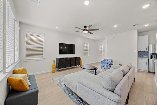 1512 Honaker Way, Leander, TX 78641 - living area featuring light wood-style flooring, recessed lighting, ceiling fan, and baseboards