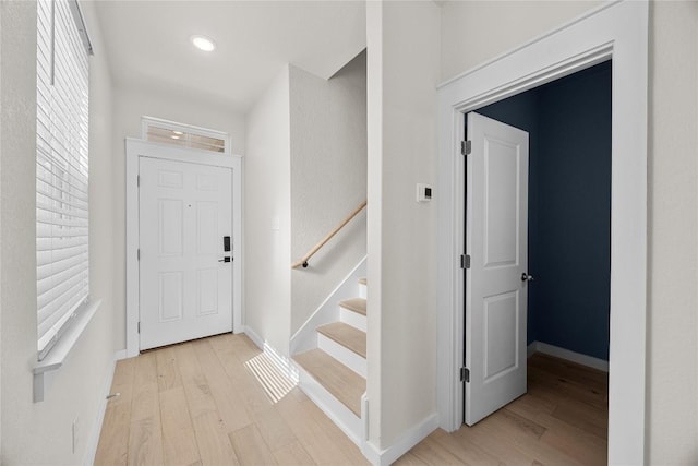 1512 Honaker Way, Leander, TX 78641 - entrance foyer with light wood finished floors, baseboards, and stairway