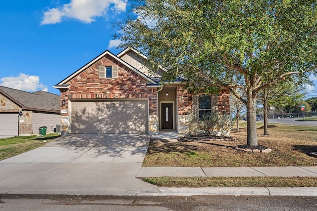 view of front of house featuring a garage, brick siding, and concrete driveway