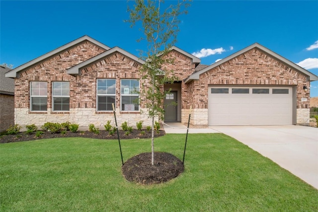 ranch-style home featuring brick siding, a garage, a front lawn, and concrete driveway