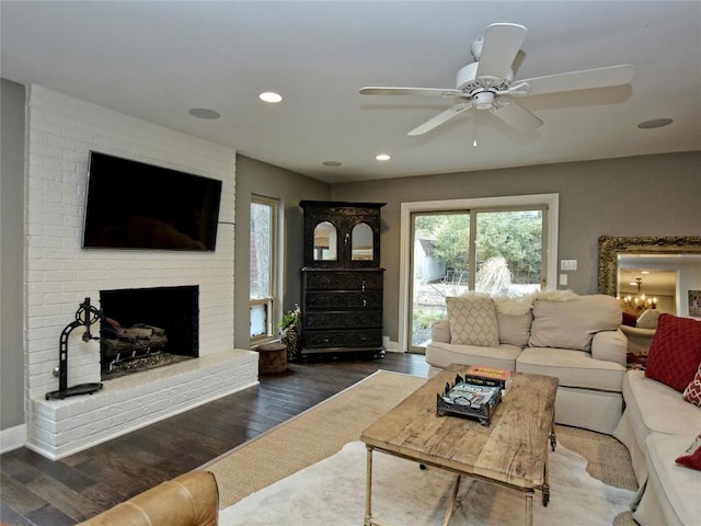 306 Briarwood Trl, Austin, TX 78746 - living area with wood finished floors, a fireplace, ceiling fan, and recessed lighting