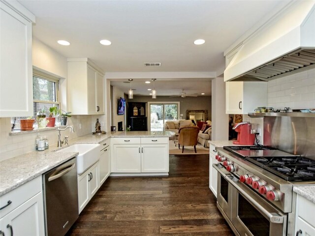 306 Briarwood Trl, Austin, TX 78746 - kitchen featuring custom exhaust hood, visible vents, a sink, backsplash, and stainless steel appliances