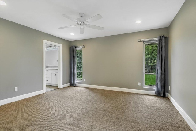 306 Briarwood Trl, Austin, TX 78746 - spare room with light carpet, baseboards, a ceiling fan, and recessed lighting