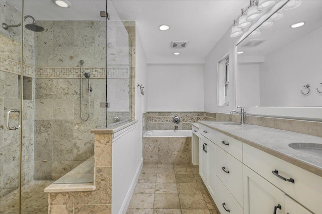 306 Briarwood Trl, Austin, TX 78746 - bathroom with a sink, double vanity, a stall shower, and a garden tub