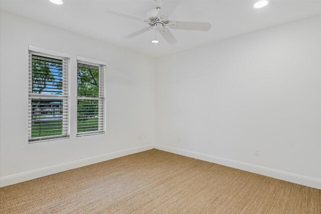 306 Briarwood Trl, Austin, TX 78746 - unfurnished room with light carpet, baseboards, and recessed lighting