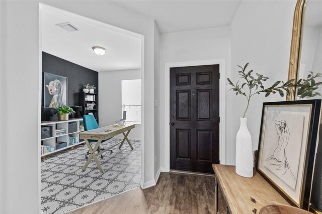 200 Isabella Way, Liberty Hill, TX 78642 - foyer entrance featuring dark wood finished floors and baseboards
