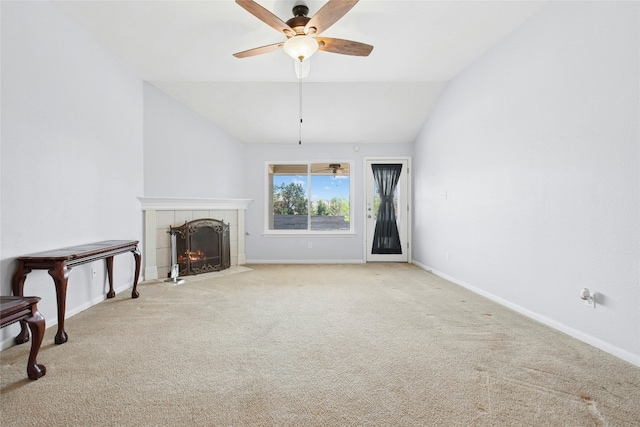 1006 Mapleridge Cir, Leander, TX 78641 - unfurnished living room with a tiled fireplace, lofted ceiling, carpet flooring, ceiling fan, and baseboards