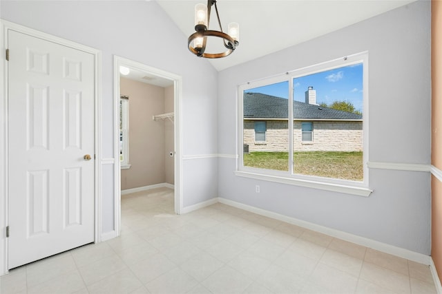 1006 Mapleridge Cir, Leander, TX 78641 - unfurnished room featuring a chandelier, vaulted ceiling, and baseboards