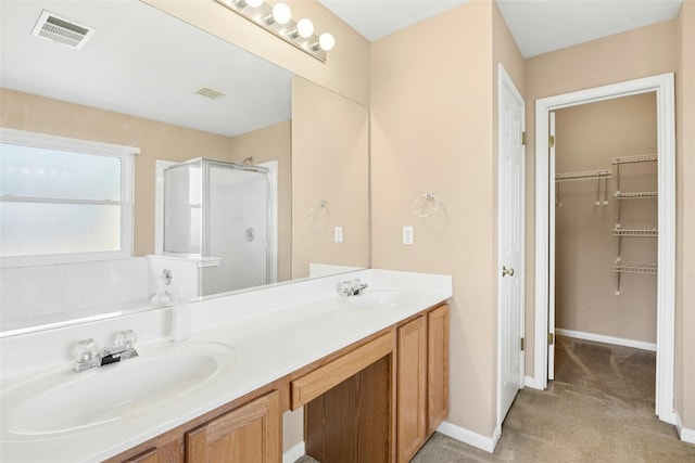 1006 Mapleridge Cir, Leander, TX 78641 - full bath with a shower stall, double vanity, a spacious closet, and baseboards