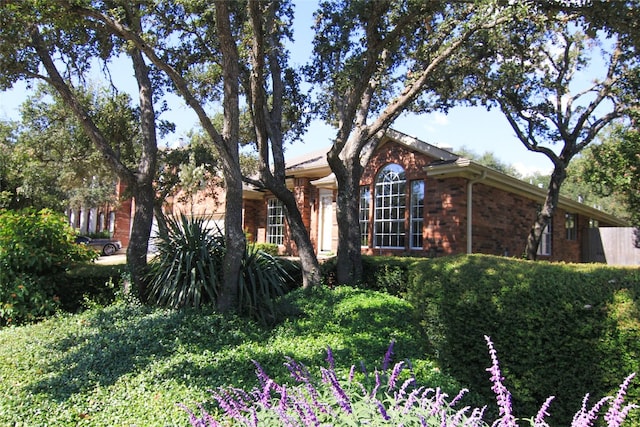 view of front of home featuring brick siding