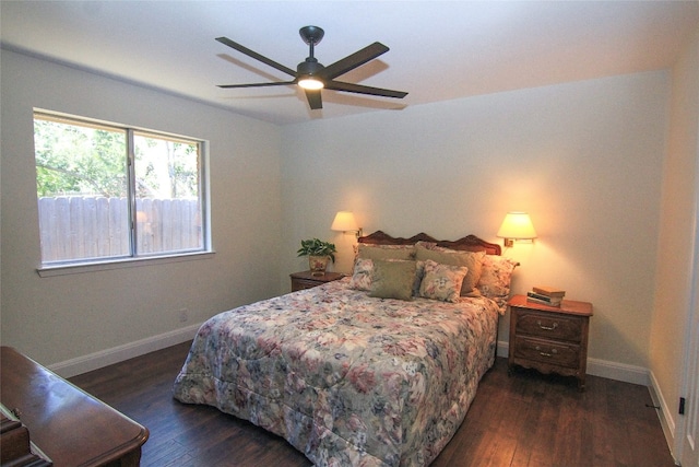 bedroom featuring baseboards, ceiling fan, and wood finished floors