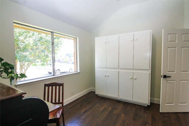 office space with baseboards, dark wood-style flooring, and lofted ceiling