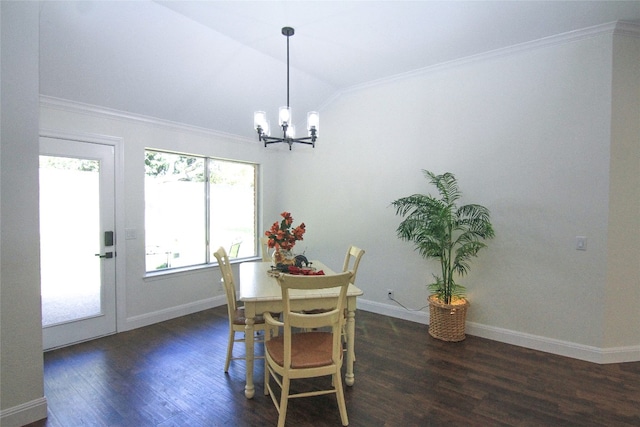 dining space featuring crown molding, a notable chandelier, dark wood finished floors, and lofted ceiling