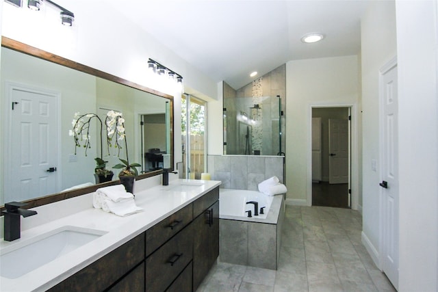 bathroom featuring lofted ceiling, a shower stall, a sink, and a bath