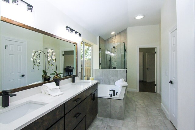 8102 Davis Mountain Pass, Austin, TX 78726 - full bathroom featuring a shower stall, a garden tub, double vanity, vaulted ceiling, and recessed lighting