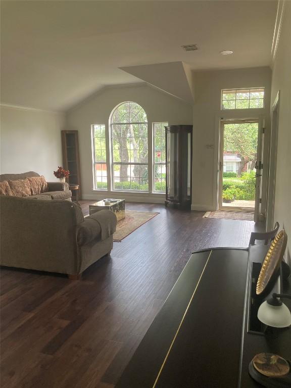 8102 Davis Mountain Pass, Austin, TX 78726 - living area with plenty of natural light, wood finished floors, and vaulted ceiling