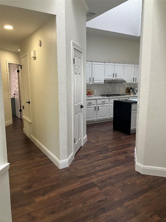 8102 Davis Mountain Pass, Austin, TX 78726 - hallway featuring baseboards and dark wood-style flooring