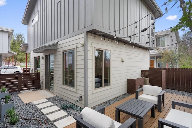 900 Banister Ln Unit D, Austin, TX 78704 - back of property featuring a deck, board and batten siding, and an outdoor living space