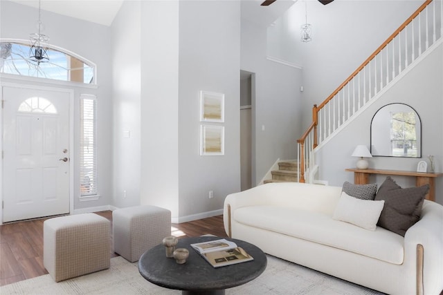 3100 Lynnbrook Dr, Austin, TX 78748 - foyer featuring a towering ceiling, wood finished floors, stairway, a ceiling fan, and baseboards
