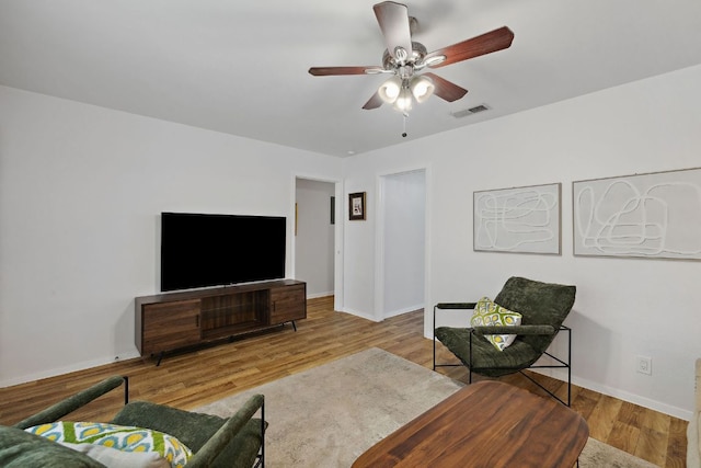 5304 Harvest Ln, Austin, TX 78745 - living room with wood finished floors, a ceiling fan, and baseboards