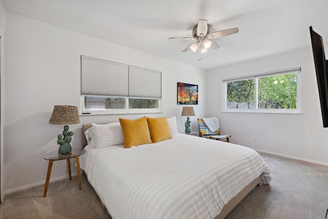 bedroom with baseboards, carpet flooring, and ceiling fan