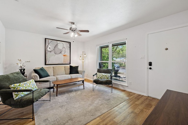 5304 Harvest Ln, Austin, TX 78745 - living room with ceiling fan, wood finished floors, and baseboards