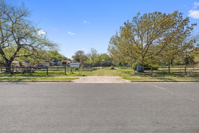 view of street with curbs