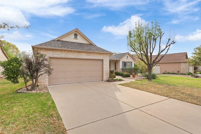 111 Belfalls Dr, Georgetown, TX 78633 - ranch-style house with stone siding, a front lawn, an attached garage, concrete driveway, and roof with shingles