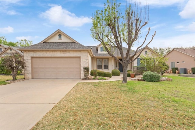 111 Belfalls Dr, Georgetown, TX 78633 - traditional home featuring stone siding, an attached garage, a front yard, and driveway