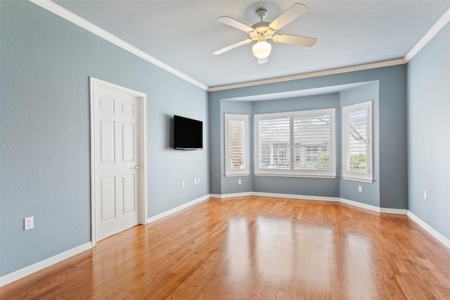 111 Belfalls Dr, Georgetown, TX 78633 - spare room featuring light wood finished floors, ornamental molding, ceiling fan, and baseboards