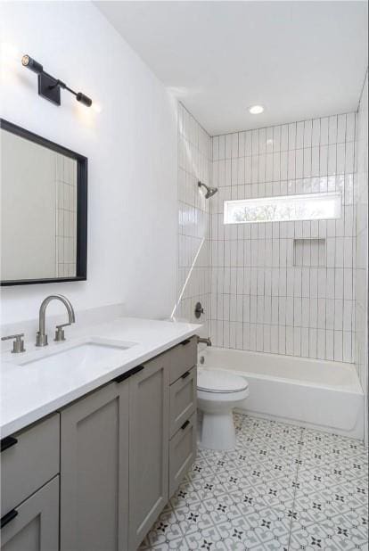 504 Normandy St Unit A, Austin, TX 78745 - full bath with vanity, washtub / shower combination, toilet, and recessed lighting