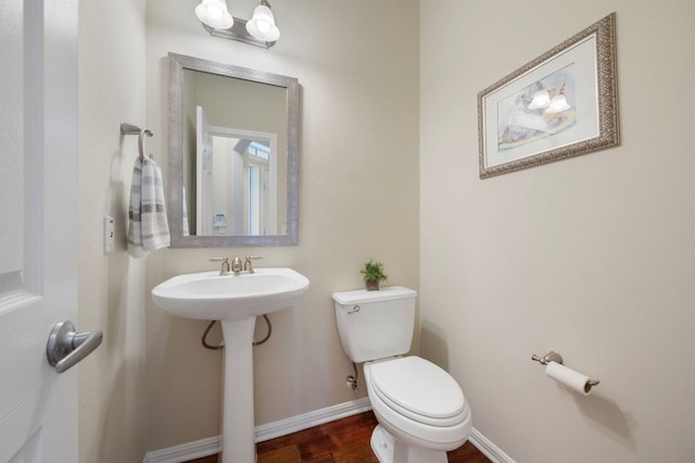 7901 SW Pkwy Unit 21, Austin, TX 78735 - bathroom with toilet, wood finished floors, and baseboards