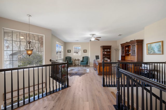 7901 SW Pkwy Unit 21, Austin, TX 78735 - hall featuring an upstairs landing and wood finished floors