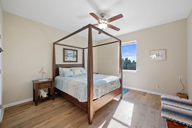 7901 SW Pkwy Unit 21, Austin, TX 78735 - bedroom featuring baseboards, light wood-style floors, and a ceiling fan