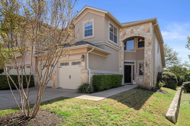 7901 SW Pkwy Unit 21, Austin, TX 78735 - view of front of property featuring stone siding, driveway, a front yard, an attached garage, and stucco siding