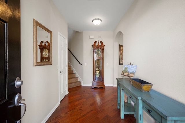 7901 SW Pkwy Unit 21, Austin, TX 78735 - entryway with arched walkways, stairway, dark wood-style floors, and baseboards
