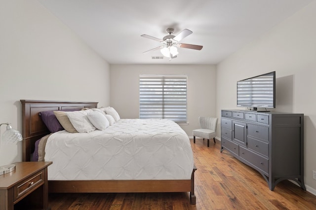 7901 SW Pkwy Unit 21, Austin, TX 78735 - bedroom featuring wood finished floors, ceiling fan, and baseboards