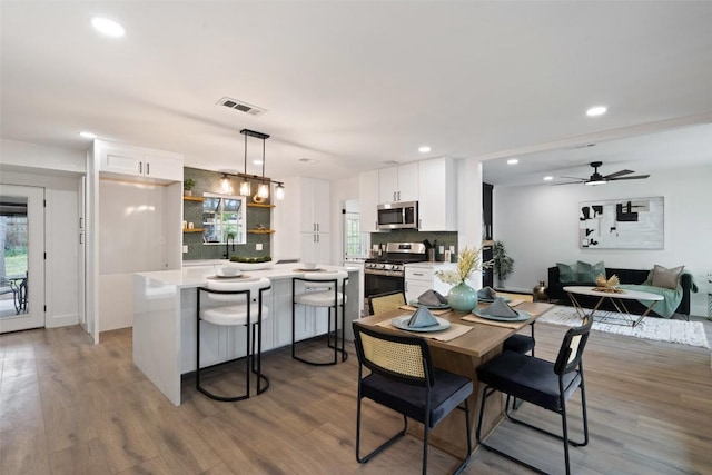 1113 Plymouth Dr, Austin, TX 78758 - dining area featuring wood finished floors, recessed lighting, and a ceiling fan