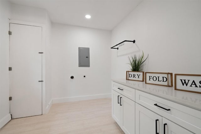1113 Plymouth Dr, Austin, TX 78758 - washroom featuring hookup for an electric dryer, electric panel, light wood finished floors, recessed lighting, and baseboards