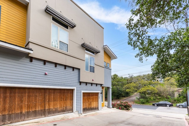 view of side of home with a garage