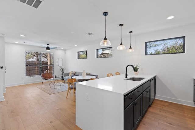 2102 Eva St Unit 2, Austin, TX 78704 - kitchen with light countertops, recessed lighting, dishwasher, light wood finished floors, and healthy amount of natural light