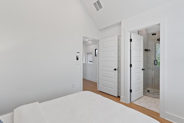2102 Eva St Unit 2, Austin, TX 78704 - bedroom with light wood-style floors and lofted ceiling