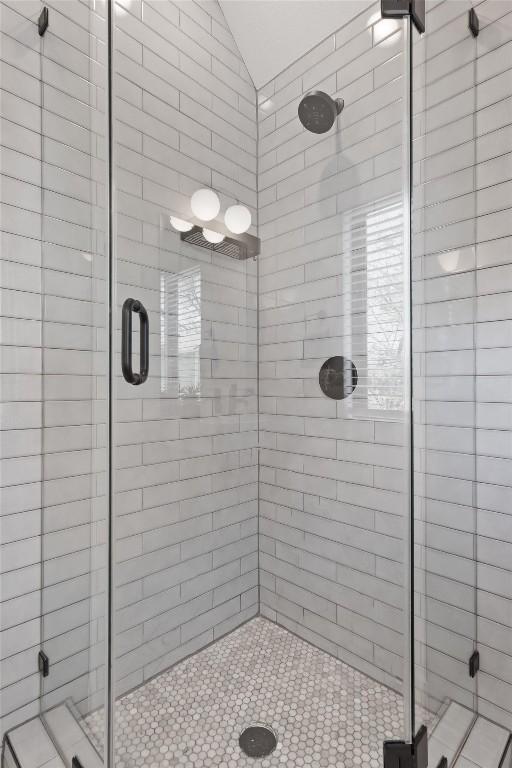 2102 Eva St Unit 2, Austin, TX 78704 - bathroom with lofted ceiling and a shower stall