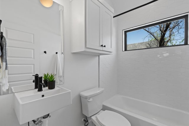 2102 Eva St Unit 2, Austin, TX 78704 - bathroom featuring toilet, a sink, and washtub / shower combination