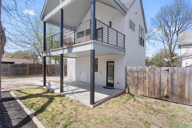 2102 Eva St Unit 2, Austin, TX 78704 - rear view of property featuring a balcony, a patio area, and a fenced backyard