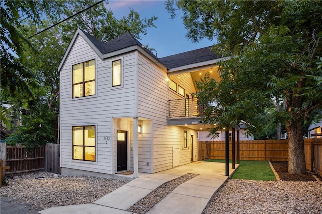 2102 Eva St Unit 2, Austin, TX 78704 - view of front of property featuring a balcony, a fenced backyard, and a patio area