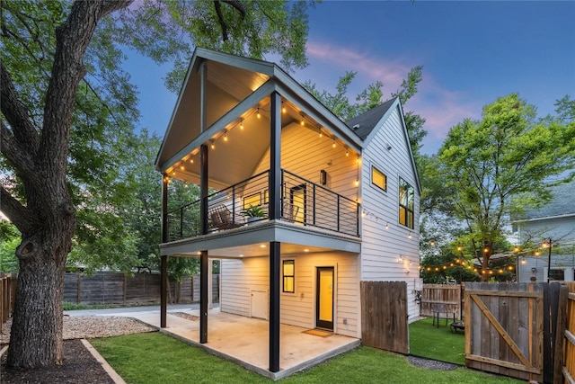 2102 Eva St Unit 2, Austin, TX 78704 - back of house with a balcony, a patio, and a fenced backyard