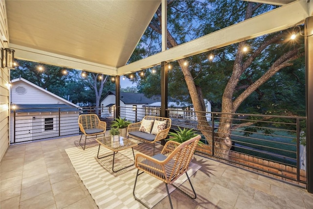 2102 Eva St Unit 2, Austin, TX 78704 - patio at twilight featuring an outdoor living space and a balcony